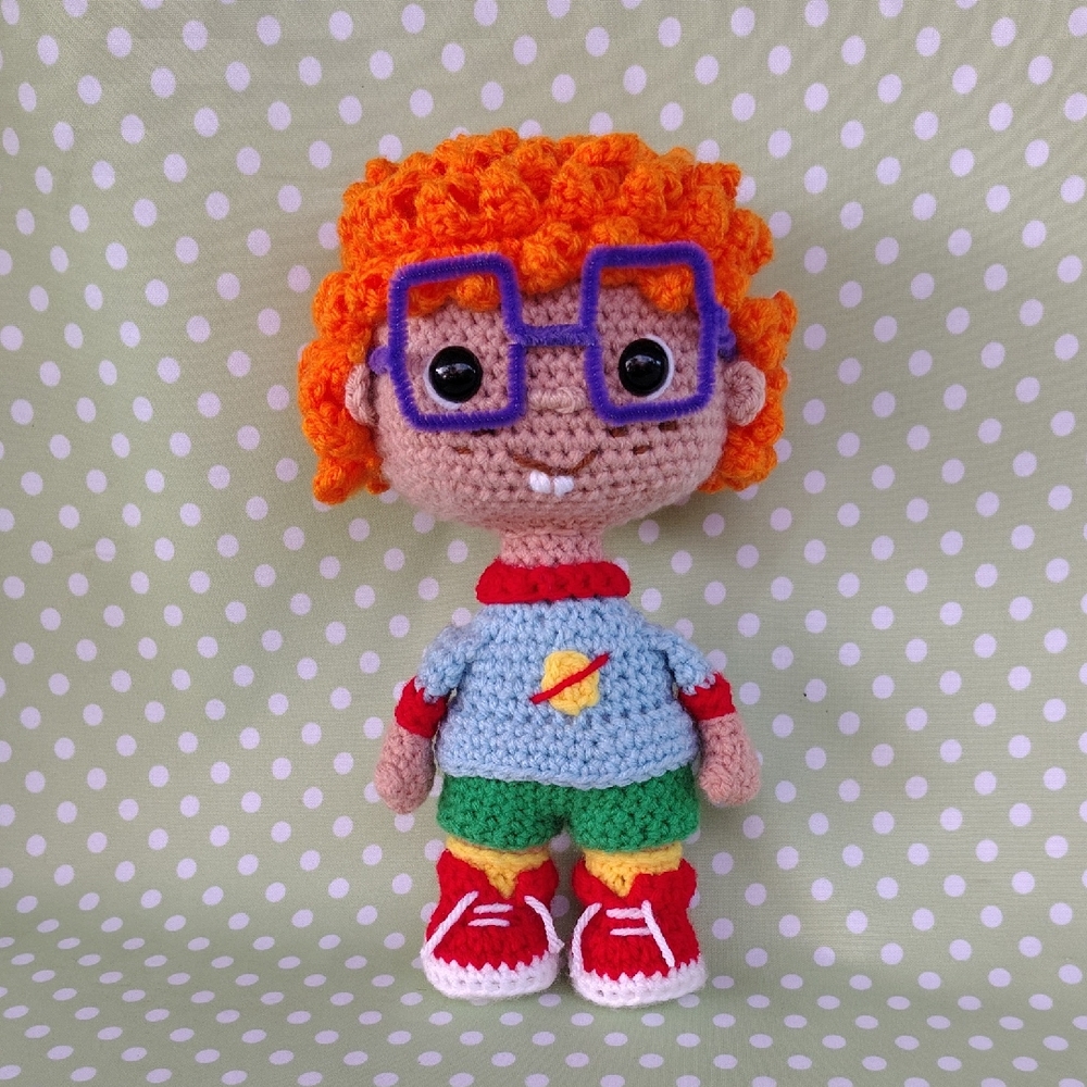 Crochet Stuffed Toy with Orange Hair and Blue Shirt
